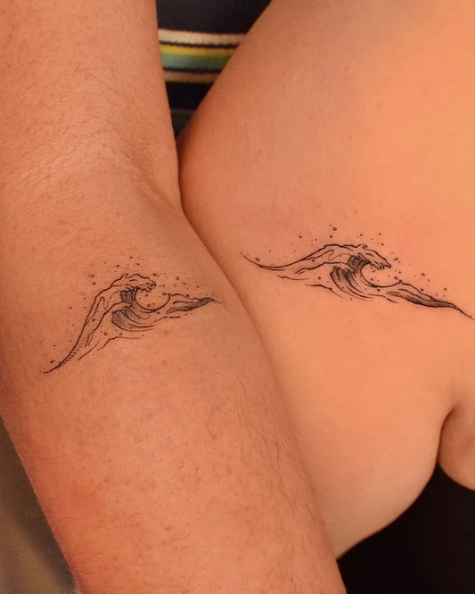 Matching Fine Line Wave Tattoo on Women Arm by @tattooer_jina
