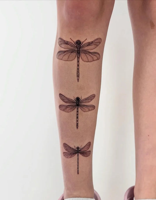 Medium 3 Black and Grey Dragonflies on Women Leg Tattoo by @lauren__tattoo