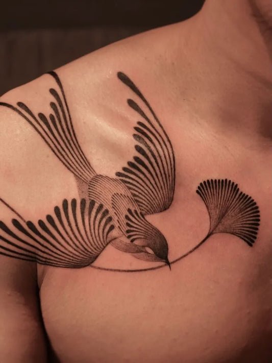 Medium Abstract Bird and Ginkgo Tattoo on Men Shoulder by @surrealismtattoo