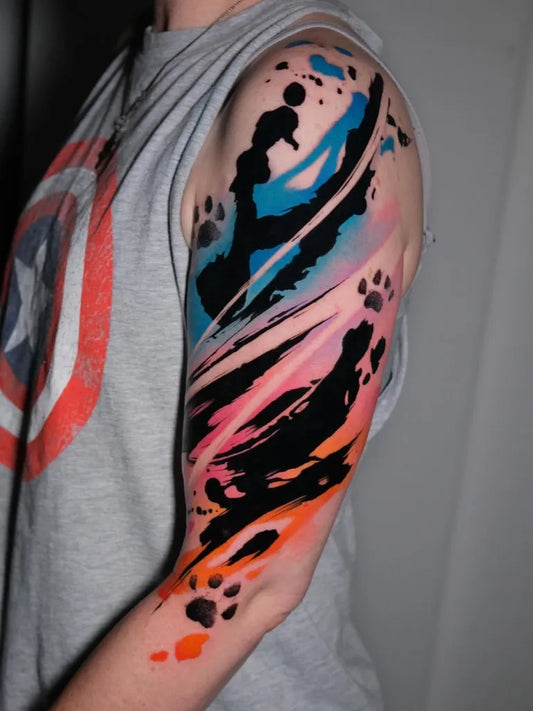 Medium Abstract Colorful Splashes and Paw Prints Tattoo on Men Shoulder by @andrea_kroki
