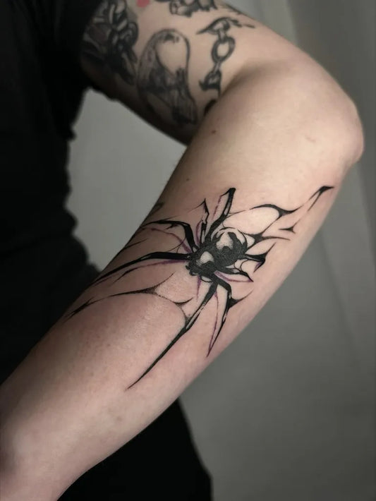 Medium Abstract Spider Tattoo on Women Arm by @lilakuhtattuh
