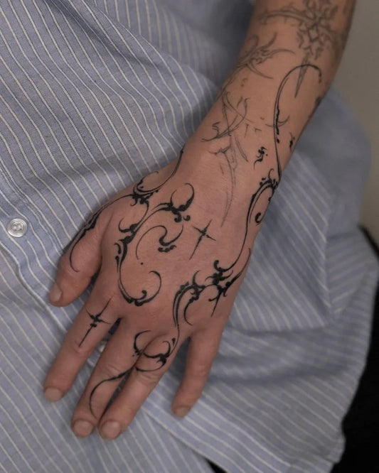 Medium Abstract Tribal Flowers Crosses Tattoo on Women Arm by @tsuki.ttt