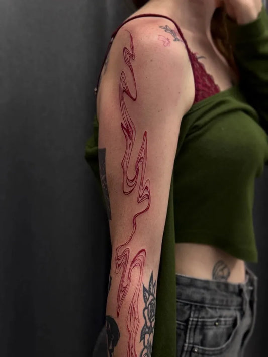 Medium Abstract Wispy Red Lines Tattoo on Women Arm by @umtisy