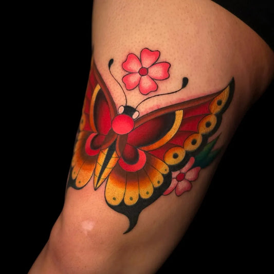 Medium American Traditional Butterfly and Flowers Tattoo on Women Arm by @sonyadelacruztattoos