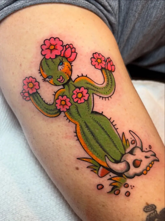 Medium American Traditional Cactus Woman with Flowers and Skull Tattoo on Women Arm by @oliv.roe