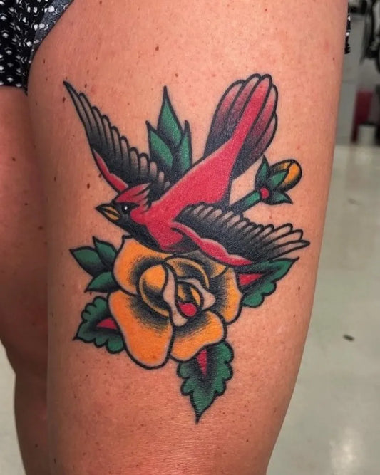 Medium American Traditional Cardinal Rose Tattoo on Women Thigh by @livebytheswordtattoo