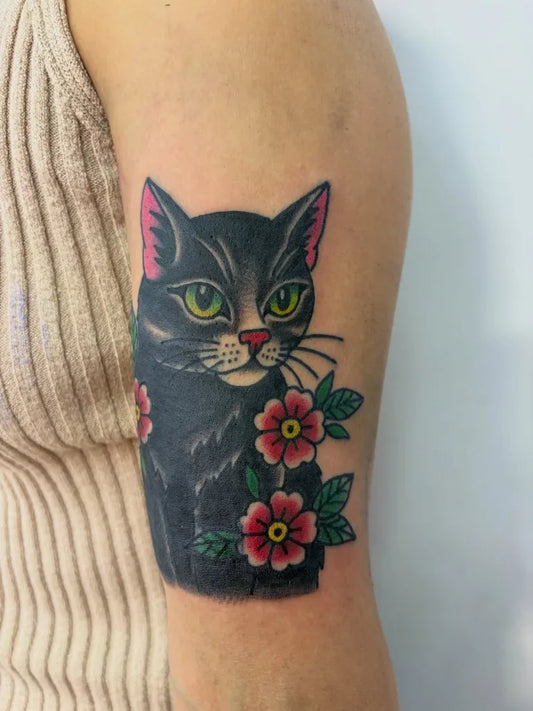 Medium American Traditional Cat with Flowers Tattoo on Women Arm by @juana_tattoo