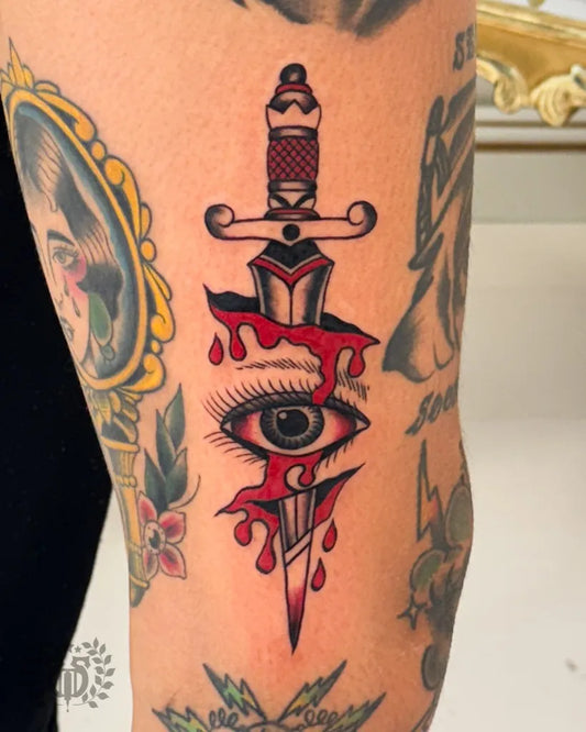 Medium American Traditional Dagger Eye Drips Tattoo on Women Thigh by @bluetattoo