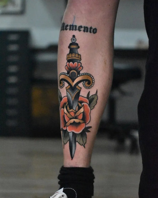 Medium American Traditional Dagger and Rose Tattoo on Men Leg by @cacticami