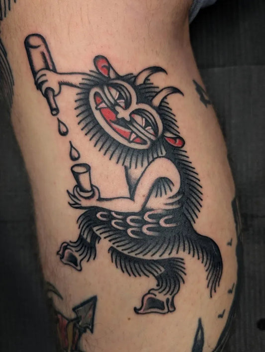 Medium American Traditional Demon Drinking Tattoo on Men Arm by @anholt.tattoo