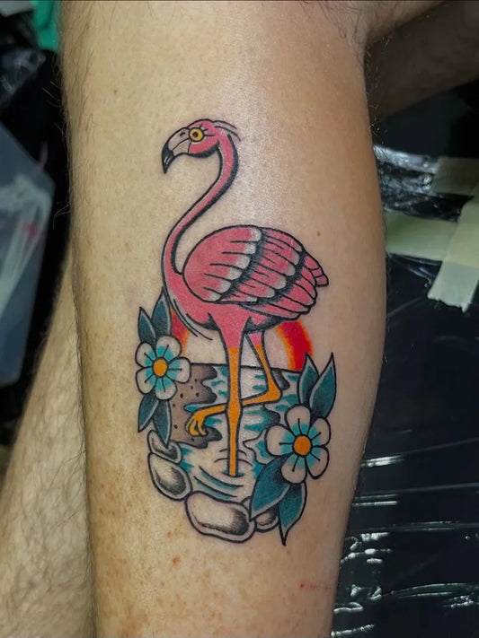 Medium American Traditional Flamingo with Flowers Tattoo on Men Leg by @inkbylennypaul