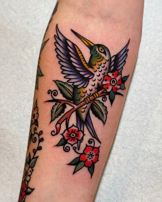 Medium American Traditional Hummingbird and Flowers on Women Arm Tattoo by @dante__royal