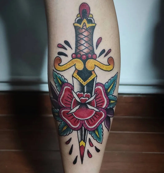 Medium American Traditional Knife and Rose Tattoo on Women Leg by @jim_mag_one