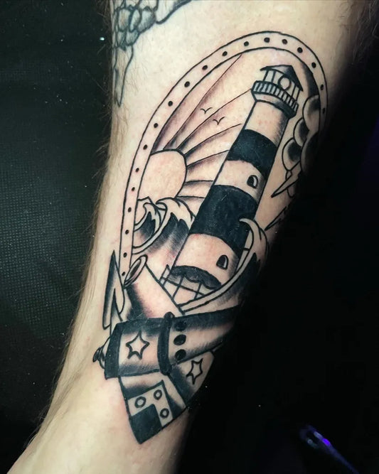 Medium American Traditional Lighthouse Ship Stars Nautical Tattoo on Men Arm by @renot_aragontattoo