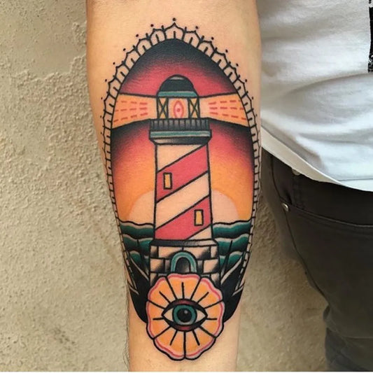 Medium American Traditional Lighthouse and Eye Tattoo on Men Arm by @perceptionfinebodyart