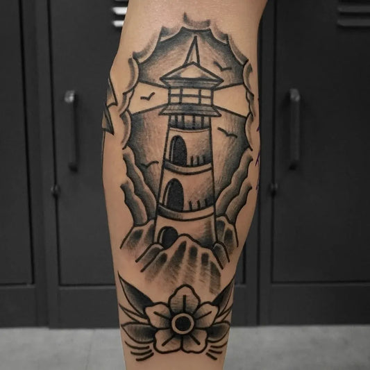 Medium American Traditional Lighthouse and Rose Tattoo on Men Calf by @tattooist_woody