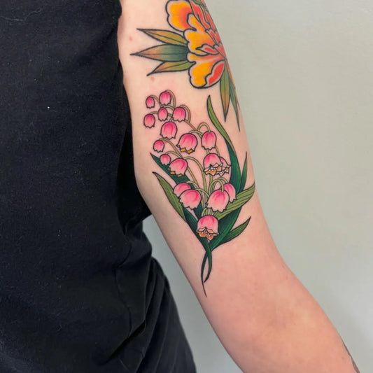 Medium American Traditional Lily of the Valley Women Arm Tattoo by @konton_tattoos