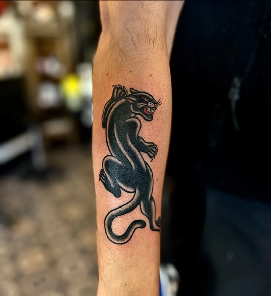 Medium American Traditional Panther Tattoo on Men Arm by @richardkenworthytattoos
