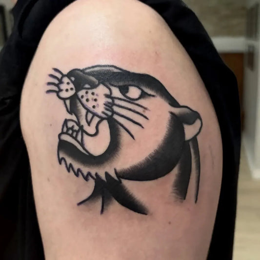 Medium American Traditional Panther Tattoo on Men Upper Arm by @tattoobraedon