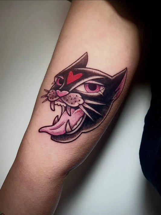 Medium American Traditional Panther Tattoo on Women Arm by @lalu_tattoo