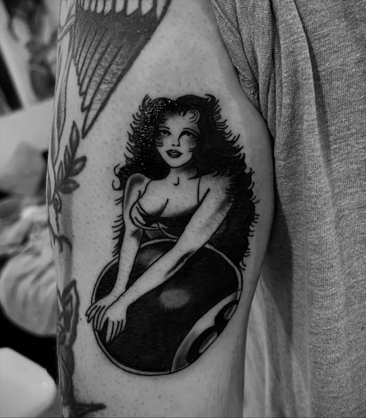 Medium American Traditional Pin Up Girl with Bowling Ball Tattoo on Women Arm by @dizzyink_