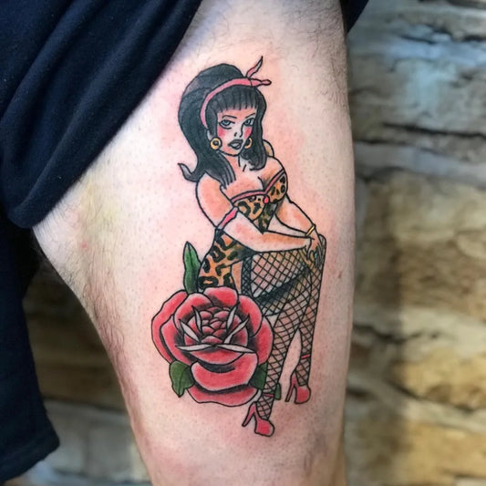 Medium American Traditional Pin Up Girl with Rose and Leopard Dress Tattoo on Men Thigh by @willo.ink
