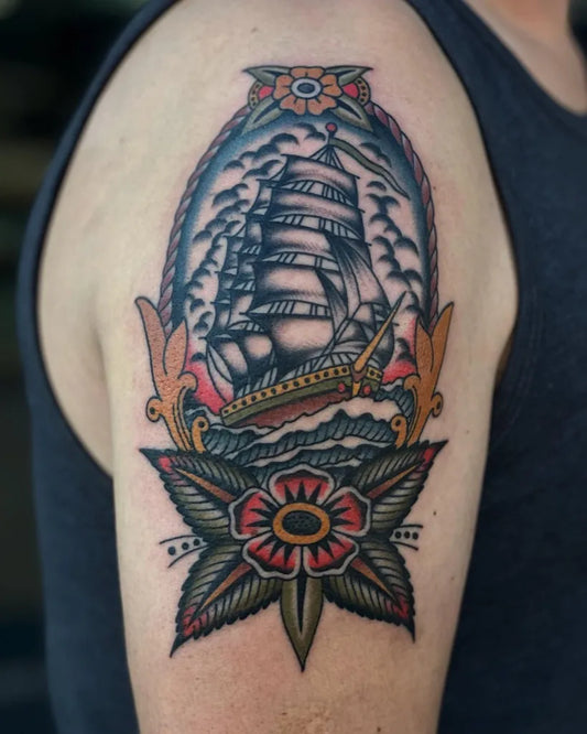 Medium American Traditional Sailing Ship Flowers Nautical Tattoo on Men Arm by @alexduquettetattoos