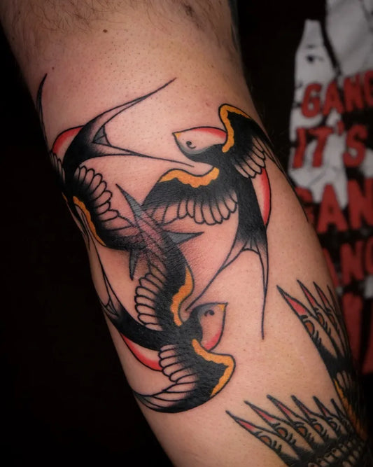 Medium American Traditional Swallows Tattoo on Men Arm by @falkmalisch