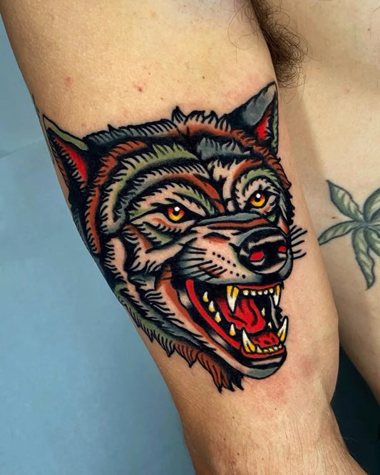 Medium American Traditional Wolf on Men Arm Tattoo by @emilianofranzil