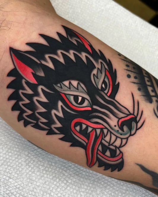 Medium American Traditional Wolf on Men Arm Tattoo by @tatturo_