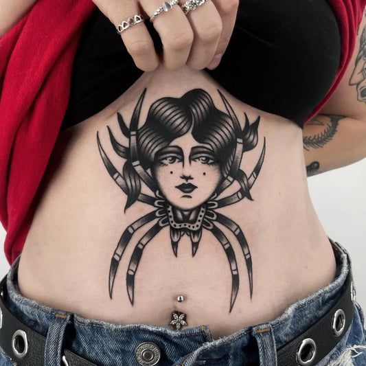 Medium American Traditional Woman with Spider Body Tattoo on Women Stomach by @angelhandstattoo