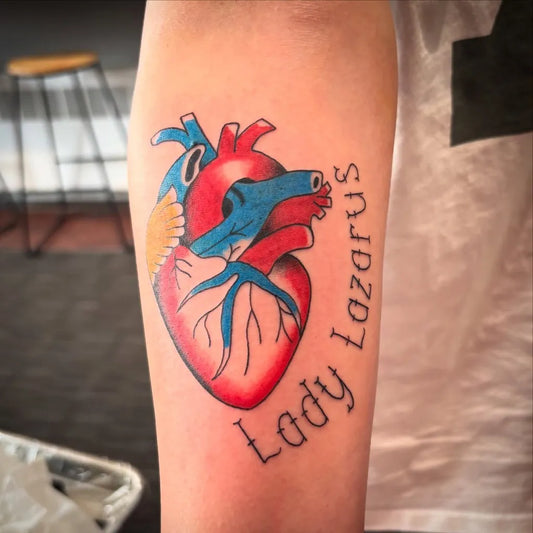 Medium Anatomical Heart Hand Heart on Women Arm Tattoo by @nerdyvisionsgallery