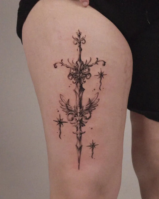 Medium Antique Sword with Wings and Stars on Women Thigh Tattoo by @zaal.tt