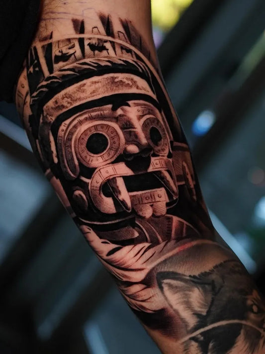 Medium Aztec Mask Tattoo on Men Arm by @jessem_tattoos
