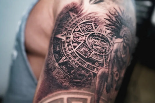 Medium Aztec Sun Stone Warrior Tattoo on Men Arm by @dylan_jonze