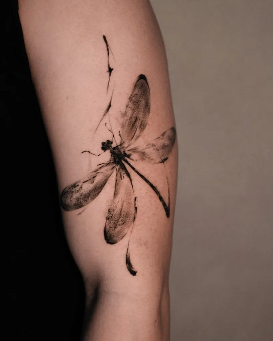 Medium Black Ink Dragonfly on Women Arm Tattoo by @tattooist_ffffkevin