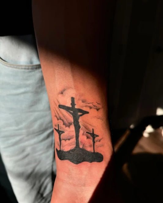 Medium Black and Grey 3 Crosses Silhouette Tattoo on Men Arm by @tk7.tats