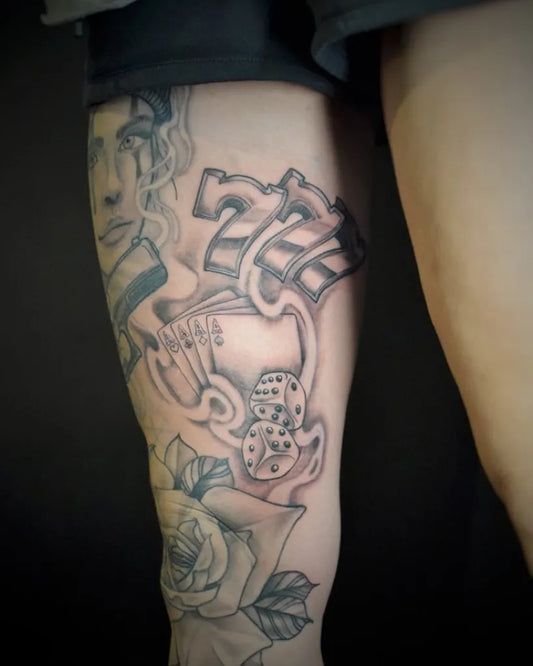 Medium Black and Grey 777 Slot Machine and Rose Tattoo on Women Thigh by @l.porten_artist
