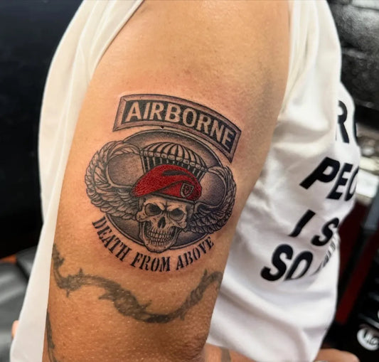 Medium Black and Grey Airborne Skull Patch Military Tattoo on Men Arm by @twistedsixsshop