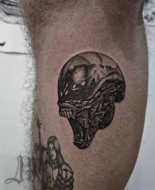 Medium Black and Grey Alien Head Tattoo on Men Thigh by @jack_padointattoo