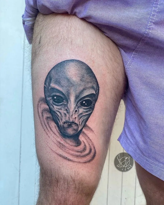 Medium Black and Grey Alien Head with Swirl Tattoo on Men Thigh by @robynlynboschart