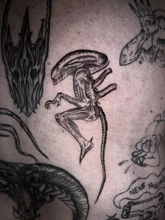 Medium Black and Grey Alien Tattoo on Men Back by @lunablacktattoo_