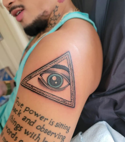 Medium Black and Grey All Seeing Eye with Quote Tattoo on Men Bicep by @lexxmariearts