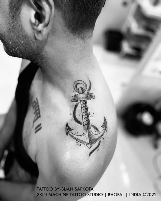 Medium Black and Grey Anchor Tattoo on Men Shoulder by @skinmachinetattoo