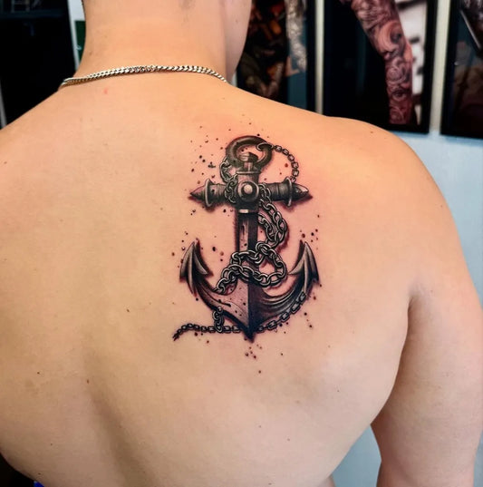 Medium Black and Grey Anchor and Chain Tattoo on Men Back by @roatattoo