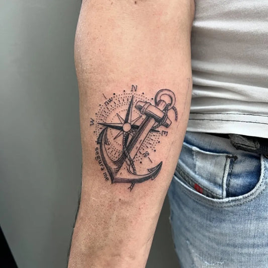 Medium Black and Grey Anchor and Compass Tattoo on Men Arm by @mikieltattoostudio