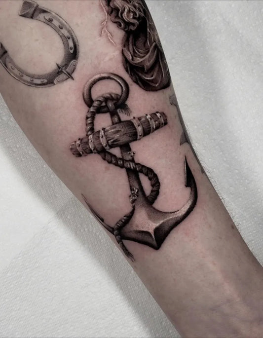 Medium Black and Grey Anchor and Horseshoe Tattoo on Men Arm by @lenihanjnrtattoos