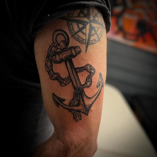 Medium Black and Grey Anchor with Chain and Compass Tattoo on Men Arm by @cfg.tattoo