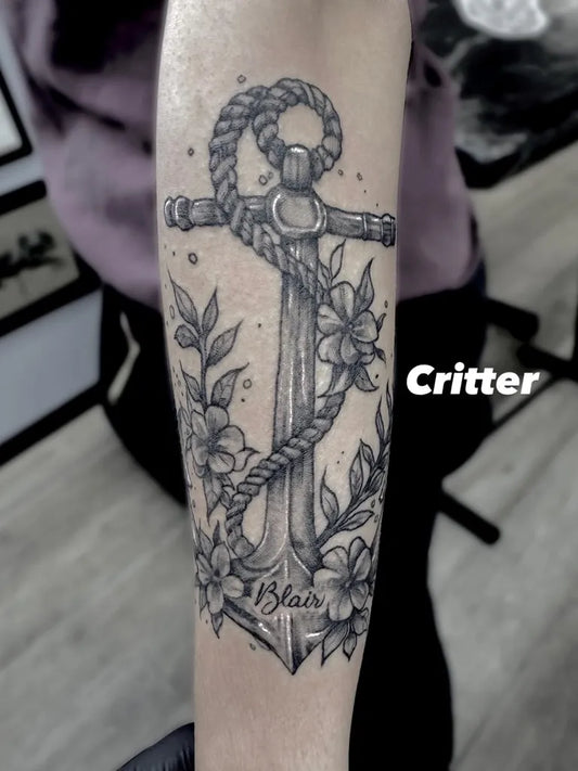 Medium Black and Grey Anchor with Flowers Tattoo on Women Arm by @crittercantdraw