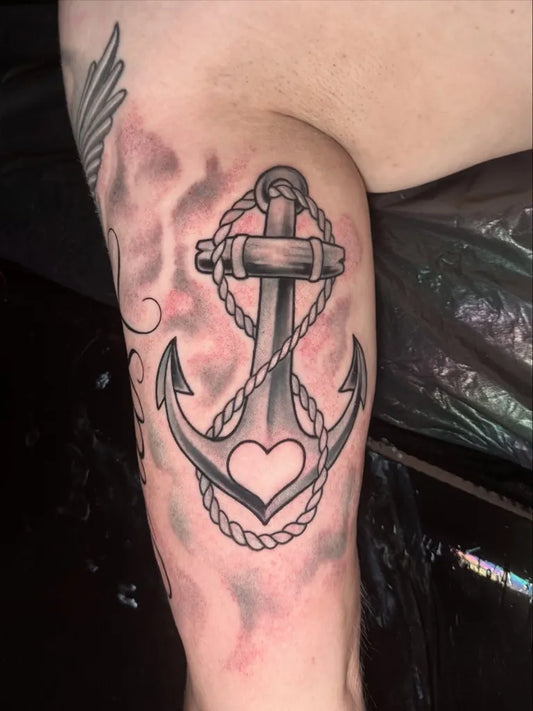 Medium Black and Grey Anchor with Heart Tattoo on Women Shoulder by @stefan_geigenfeind_tatowierer